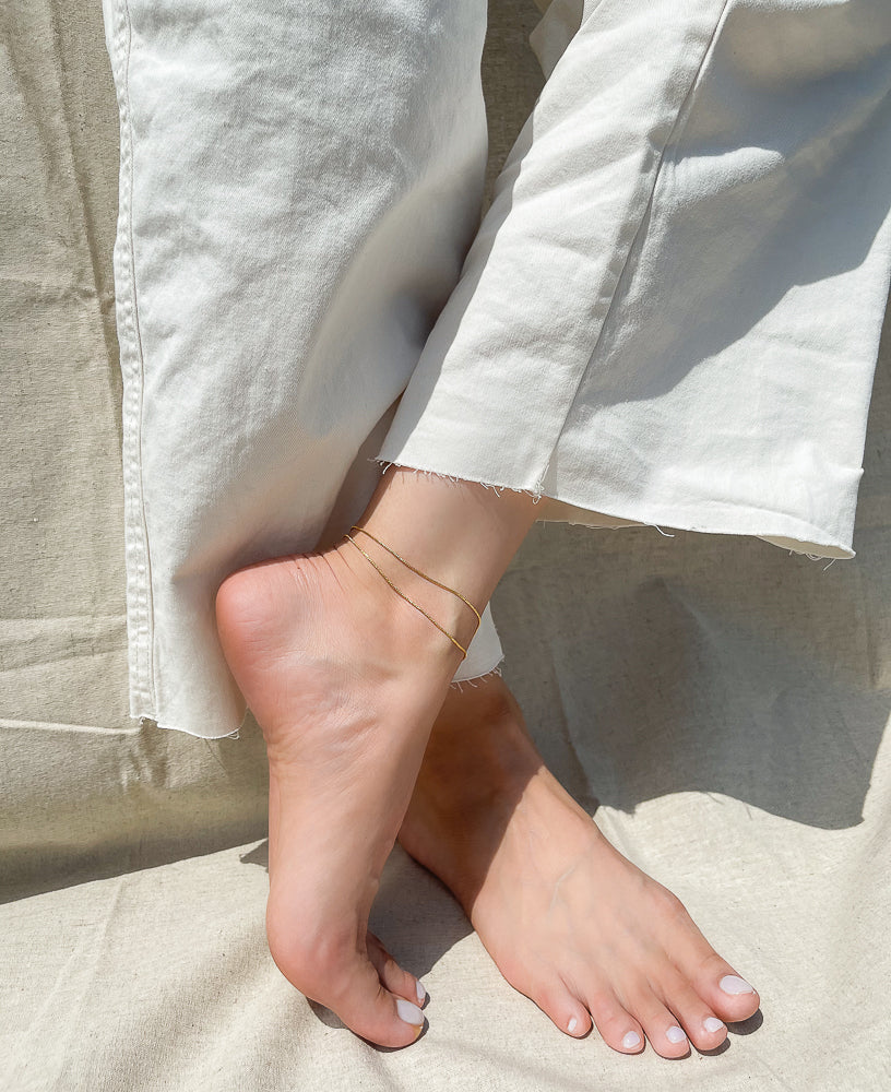 Lifestyle shot of Carmine 14k gold-filled anklet from Sachelle Collective 