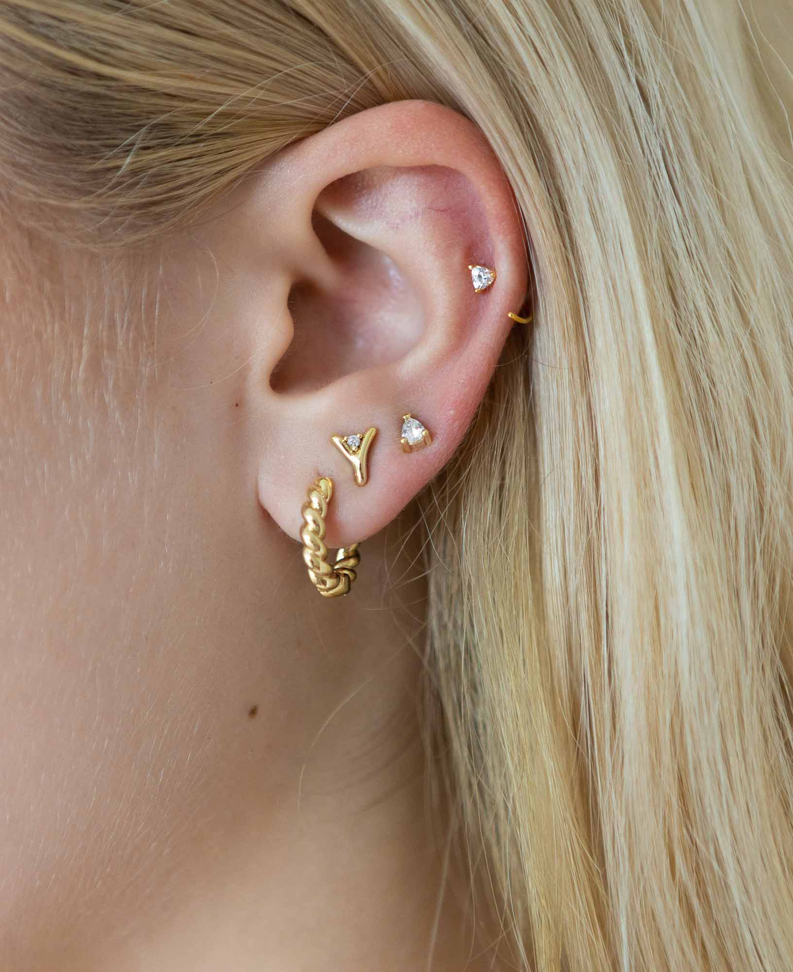 earring stack of Natalie french twist gold hoop earrings