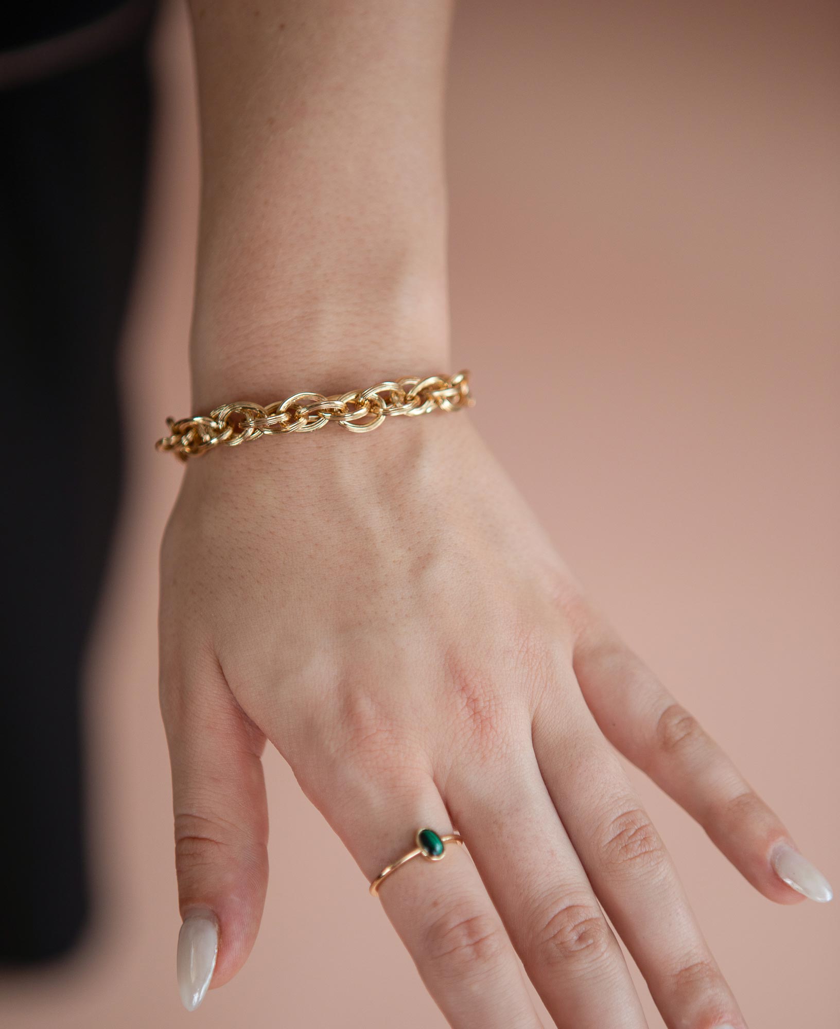 model shot of ollie chunky chain gold bracelet and jane malachite bezel ring