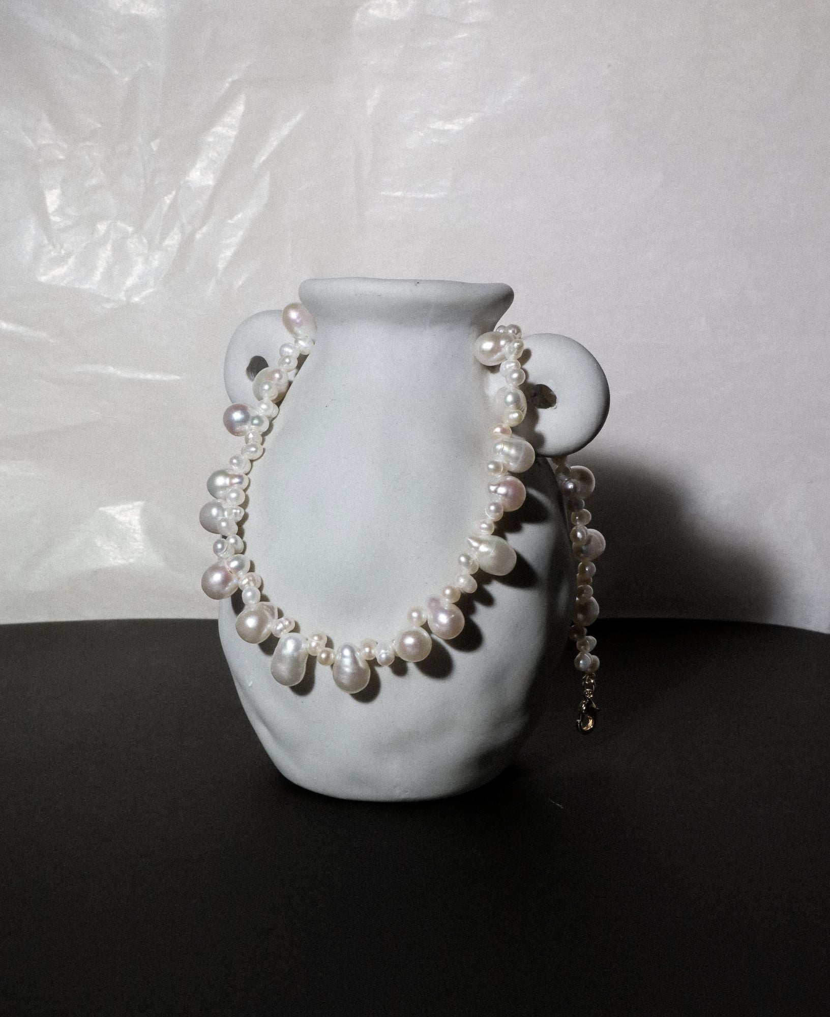 artistic lifestyle shot of Isla Teardrop Baroque Pearl Choker Necklace