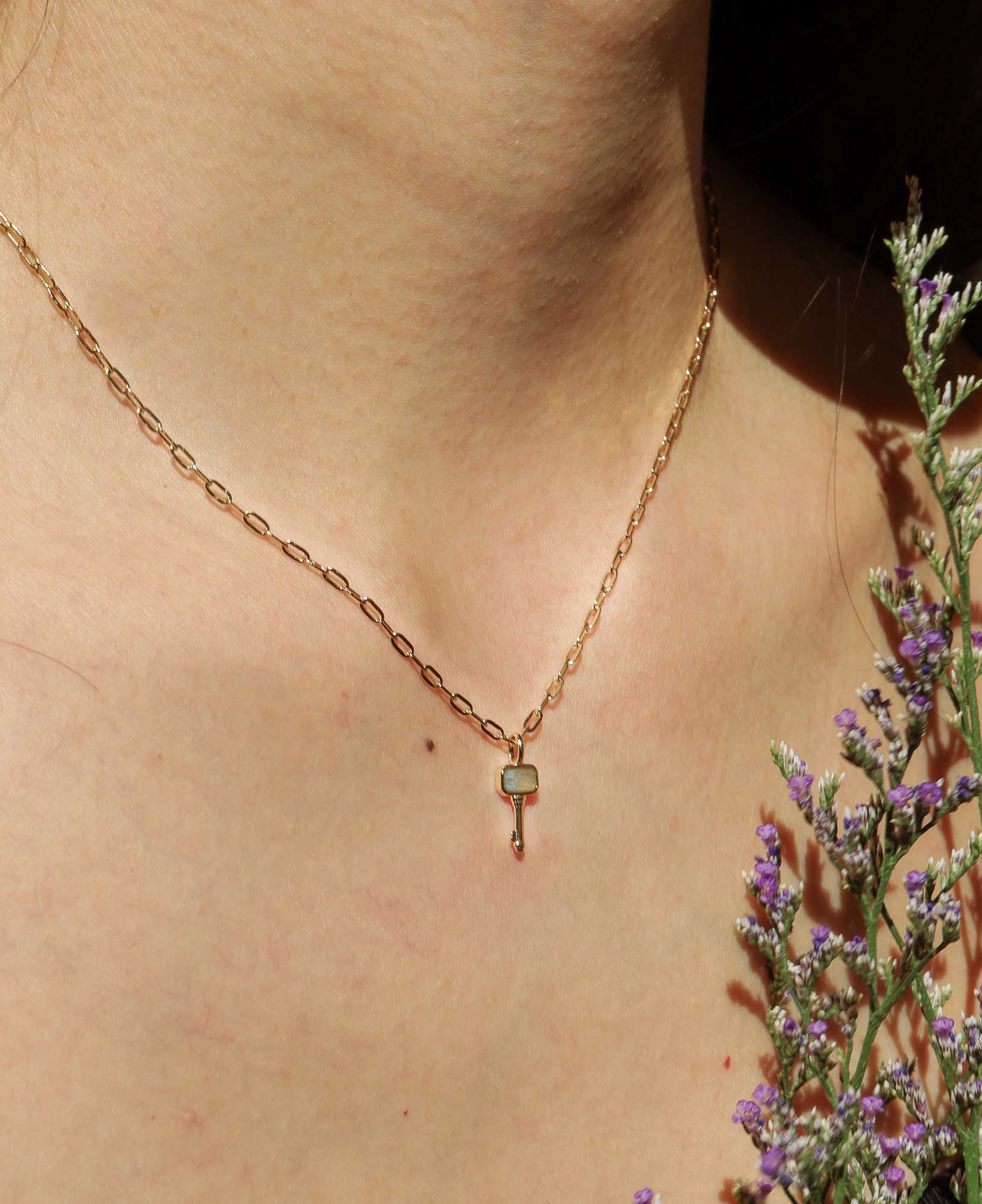 the Francoise Labradorie Key Pendant Chain Necklace featured on a model.