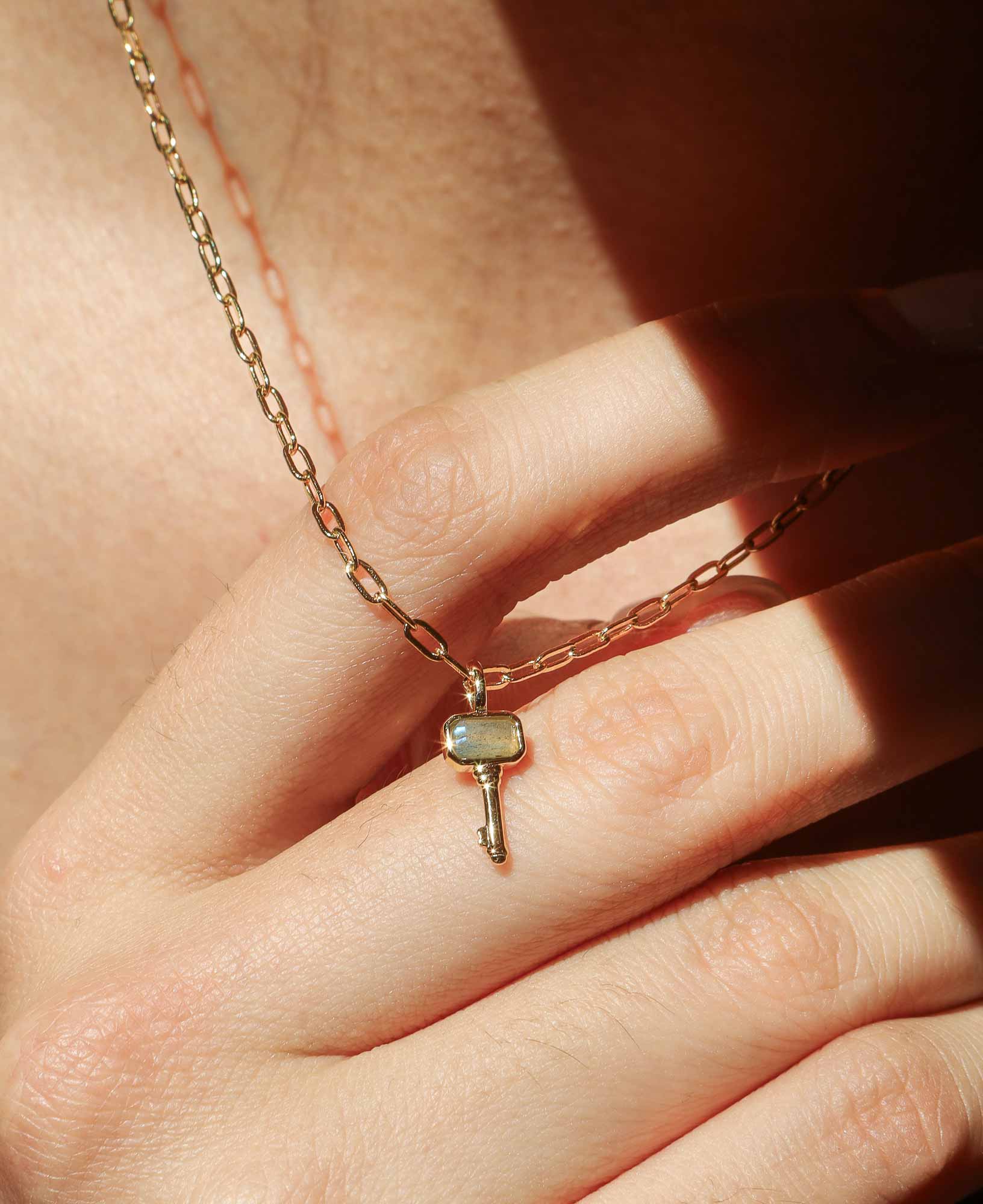 the Francoise Labradorite Key Pendant Chain Necklace featured on a model.