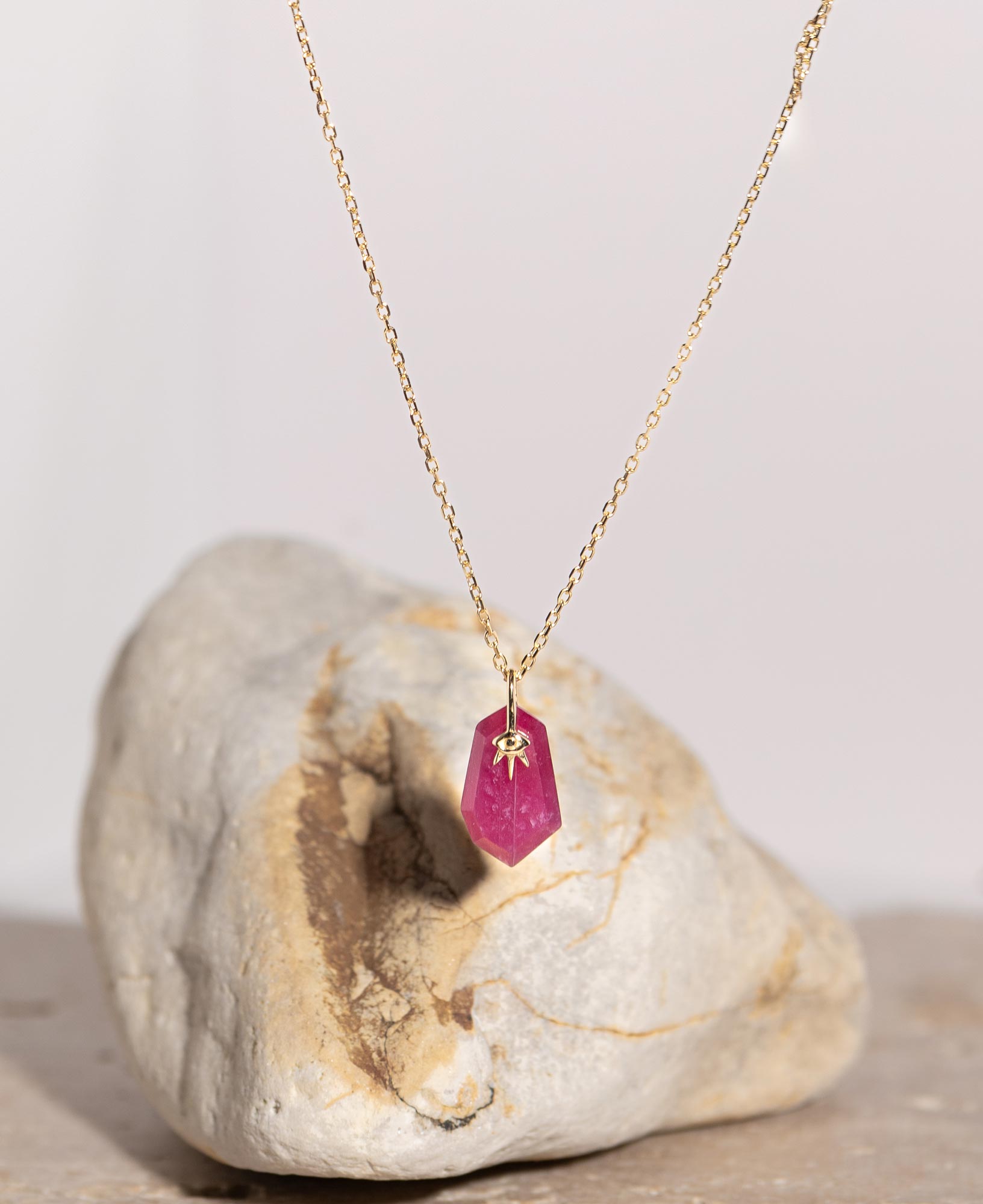 lifestyle product shot of sienna ruby 14k solid gold necklace