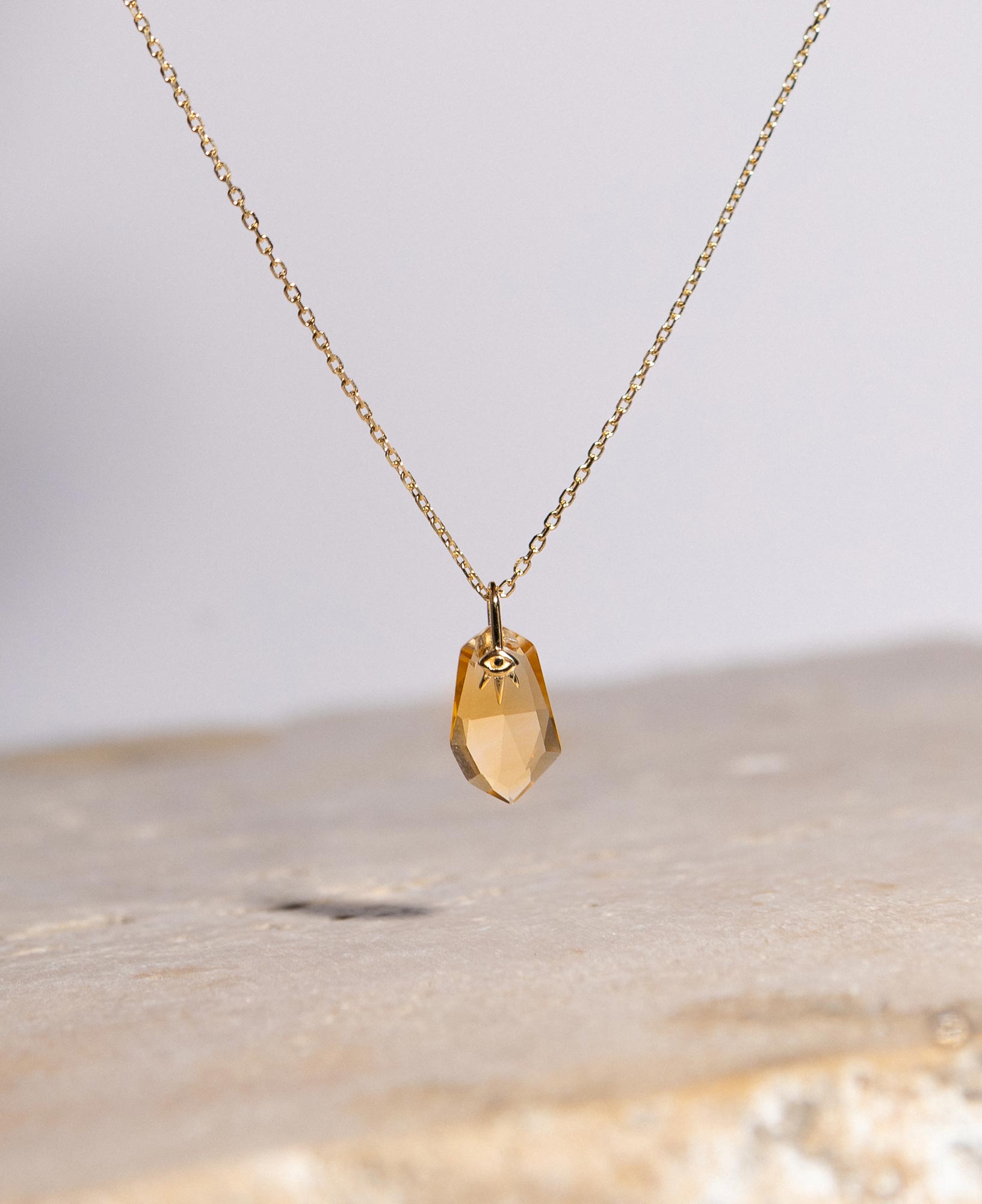 lifestyle product shot of zephyr solid gold necklace