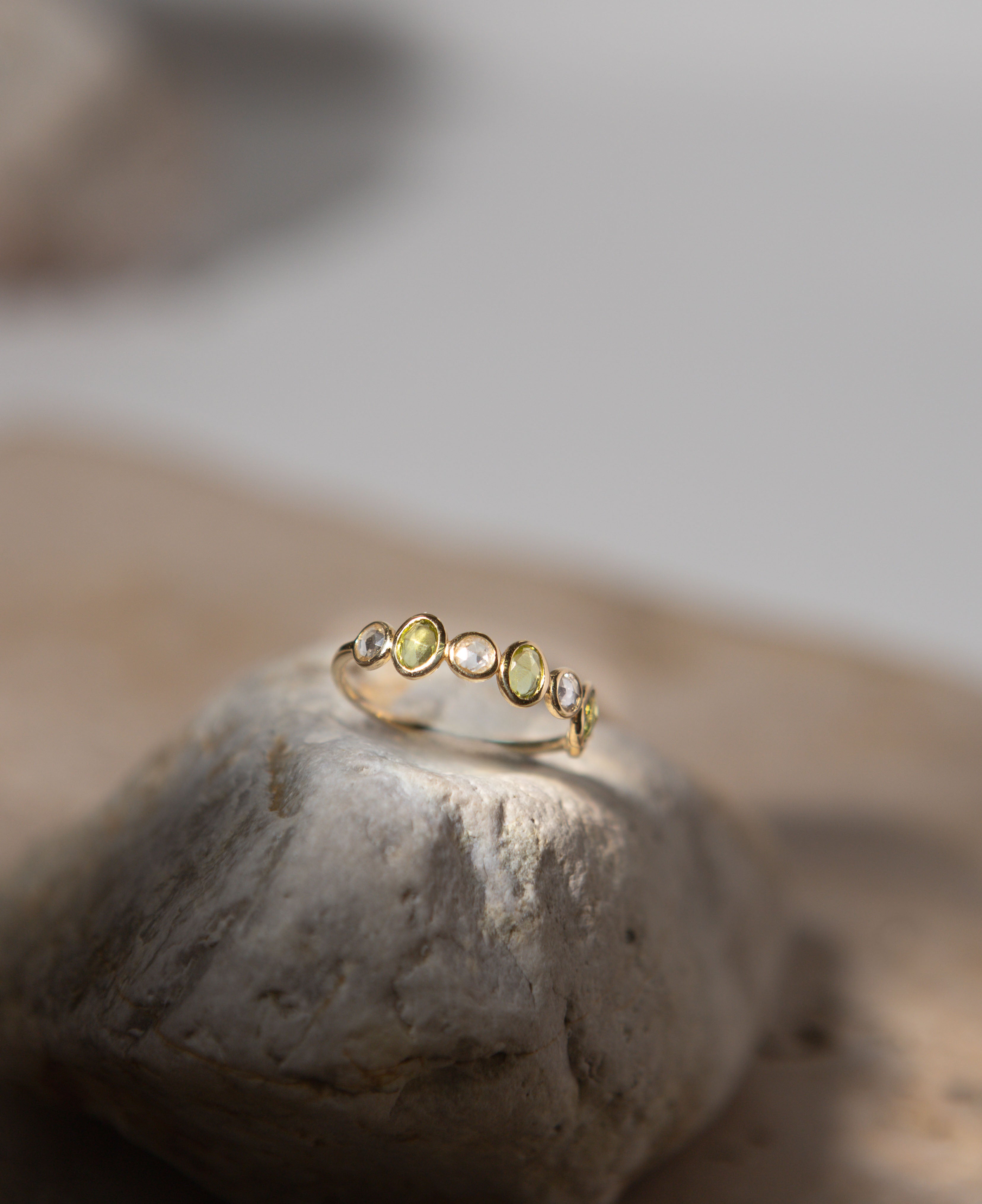lifestyle product shot of genevieve half eternity solid gold ring