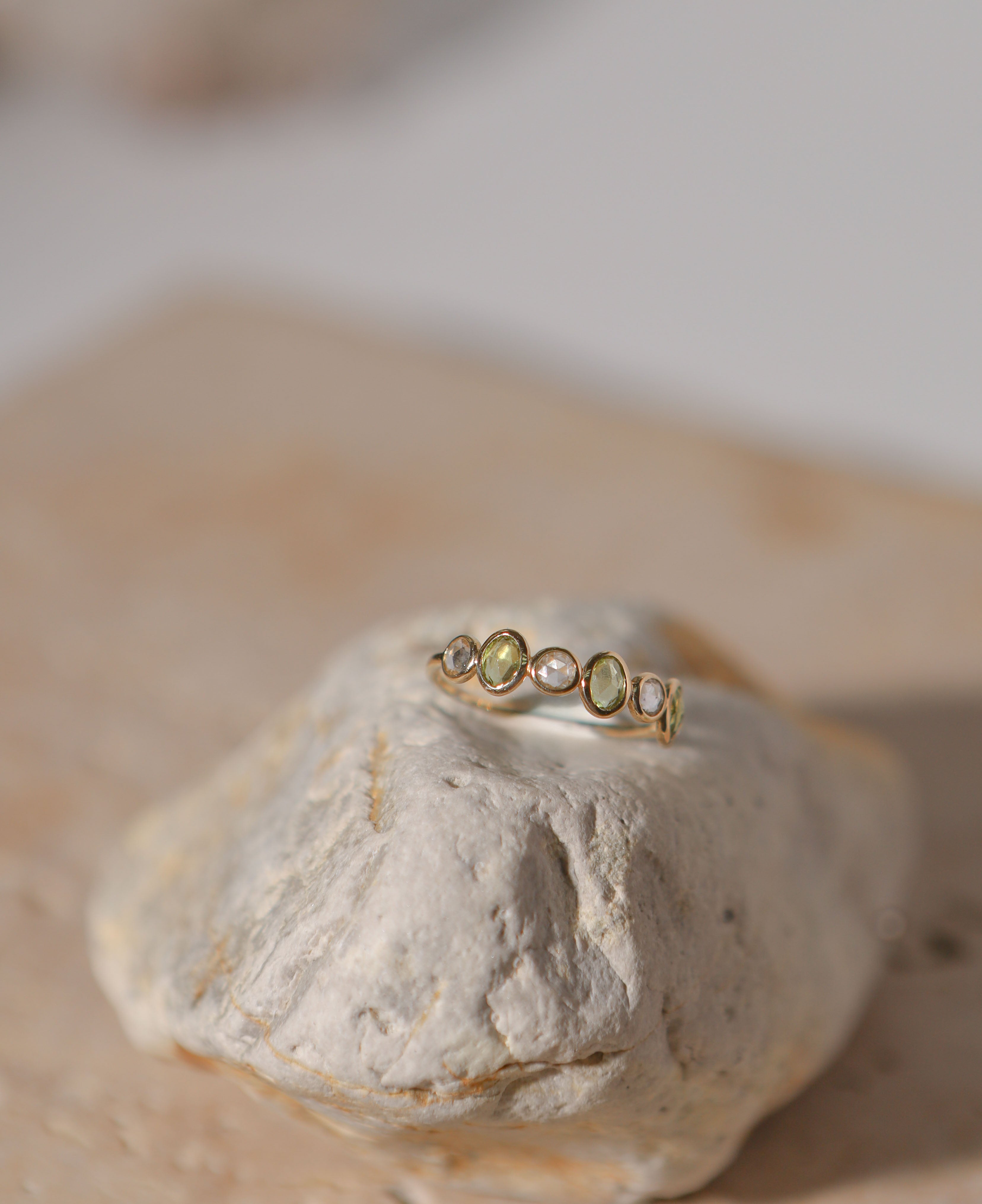 lifestyle product shot of genevieve half eternity solid gold ring