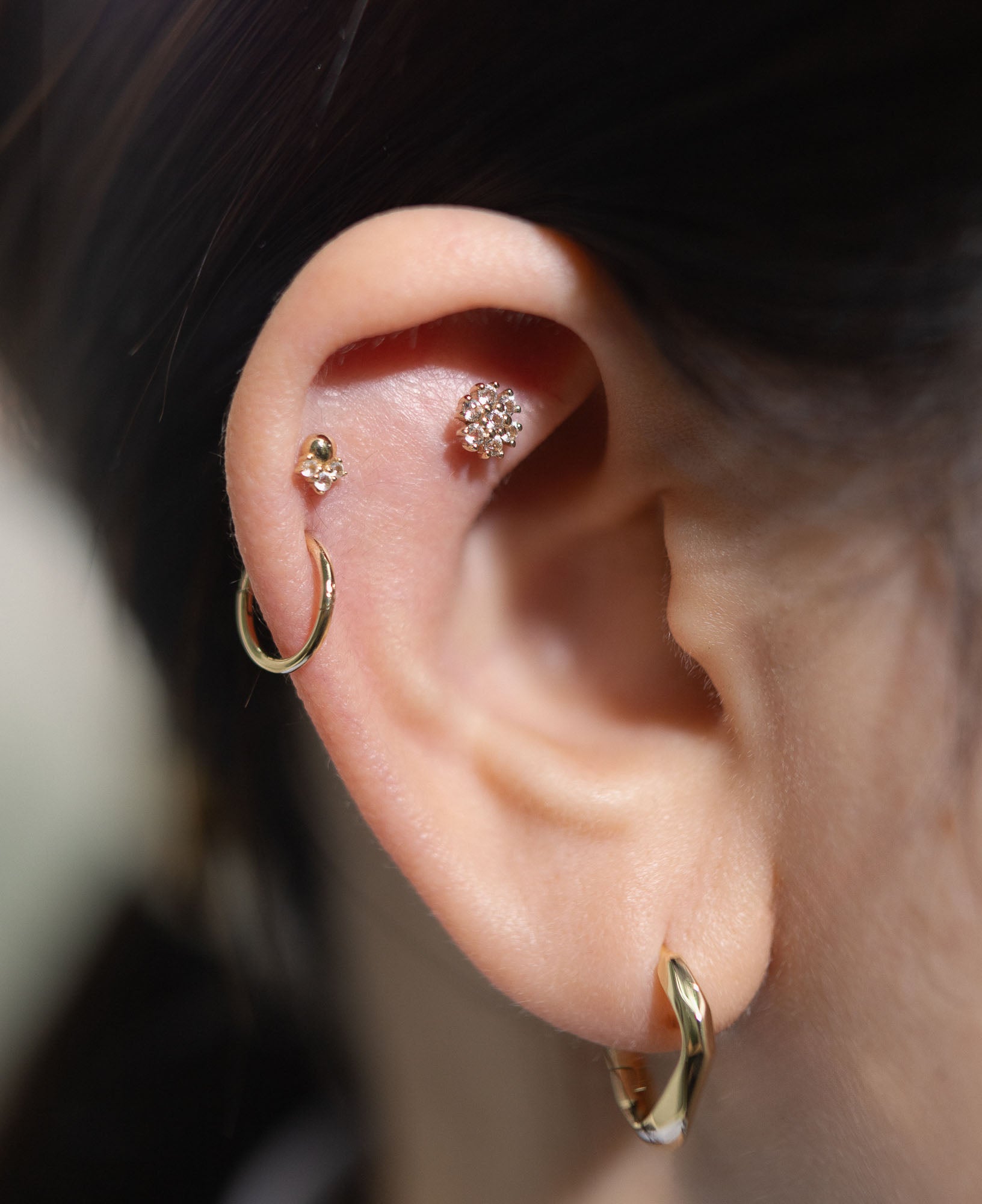 model shot of Gaia 14k solid gold white sapphire flatback stud