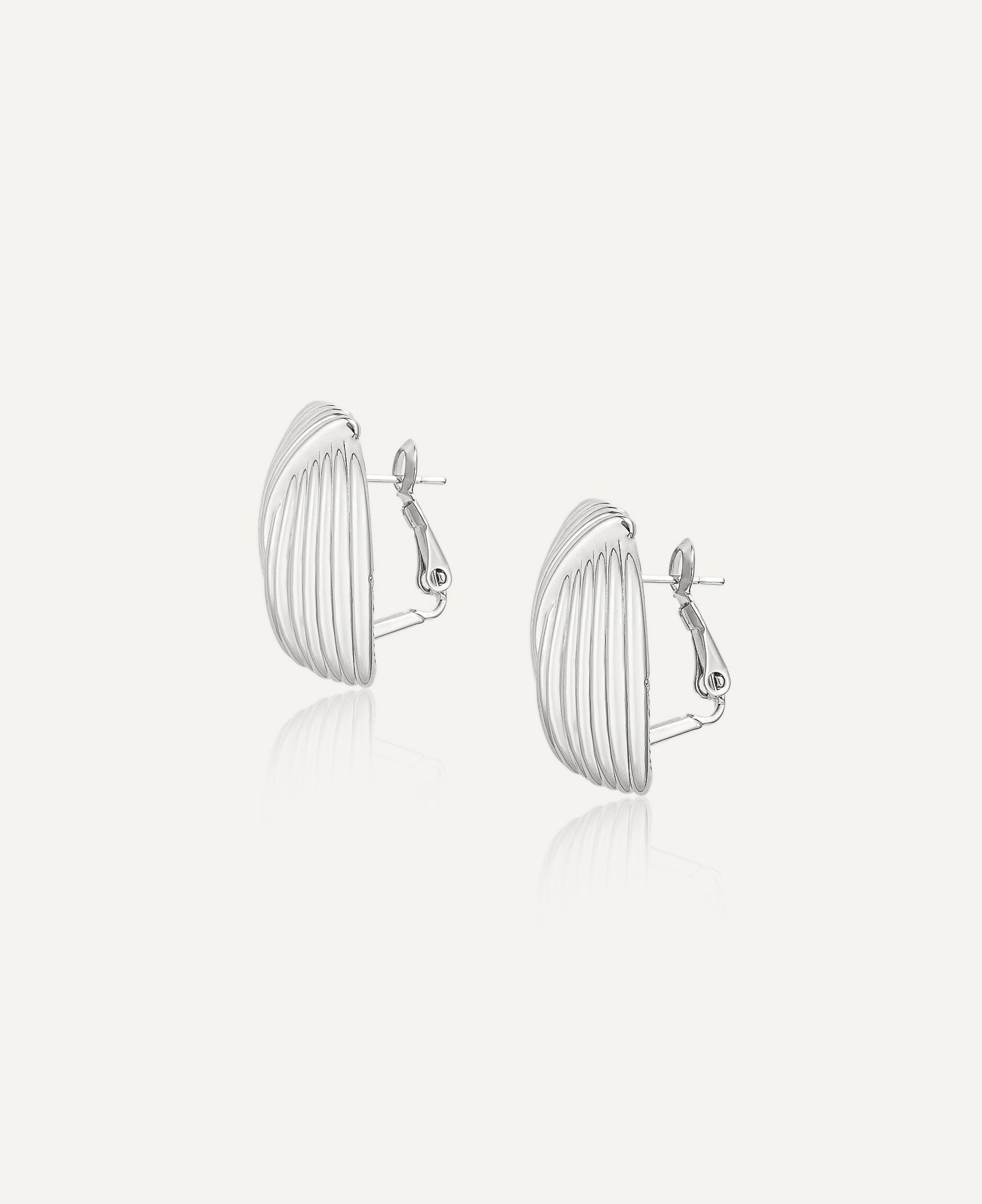 Side view of Laverne Illusion Knot Silver Statement Earrings.