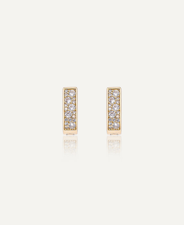 Product picture of Paloma Reversible CZ Huggie Hoop Earrings.