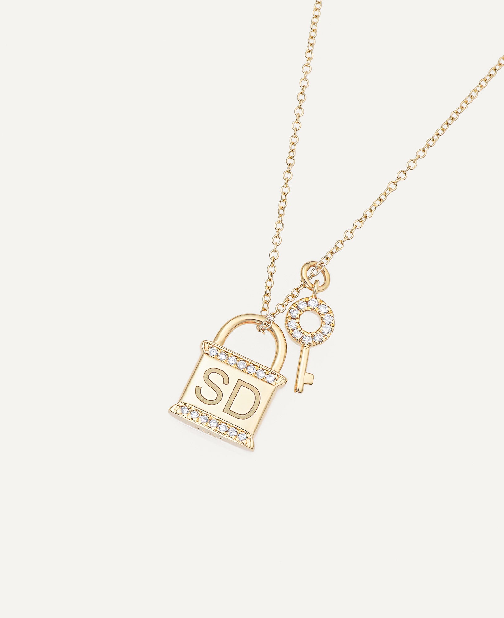 product shot of Leighton Custom Engraved Lock-and-Key Necklace with Diamonds in 14k Yellow Gold