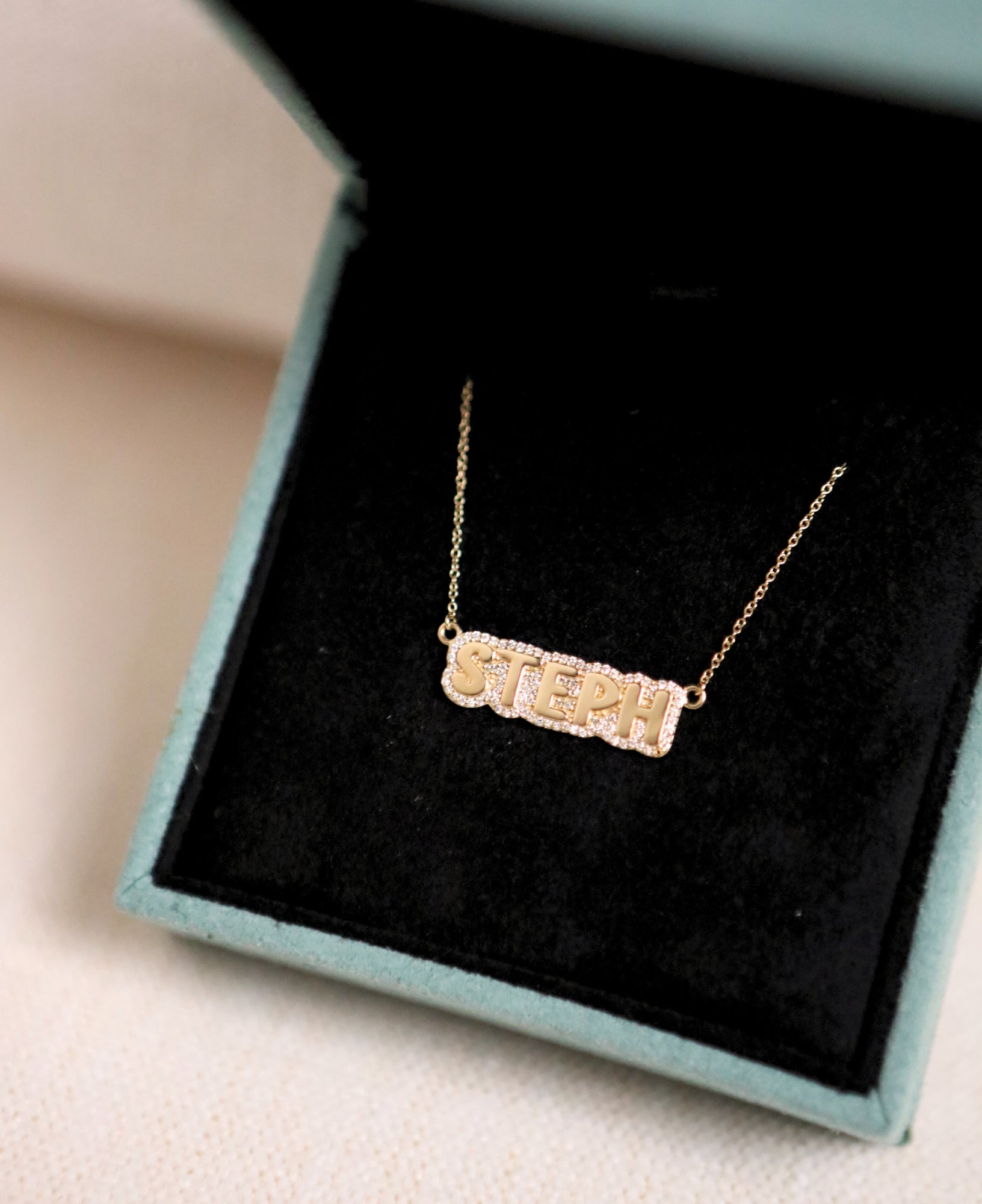 product shot of polly custom diamond mini bubble name necklace