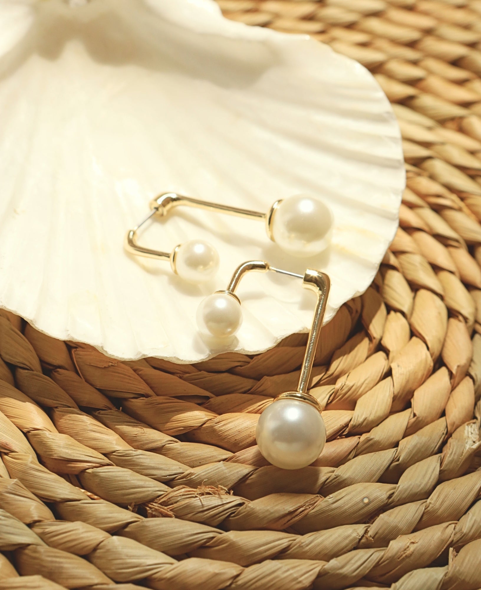 flay lay product shot of August Pearl Threader Earrings