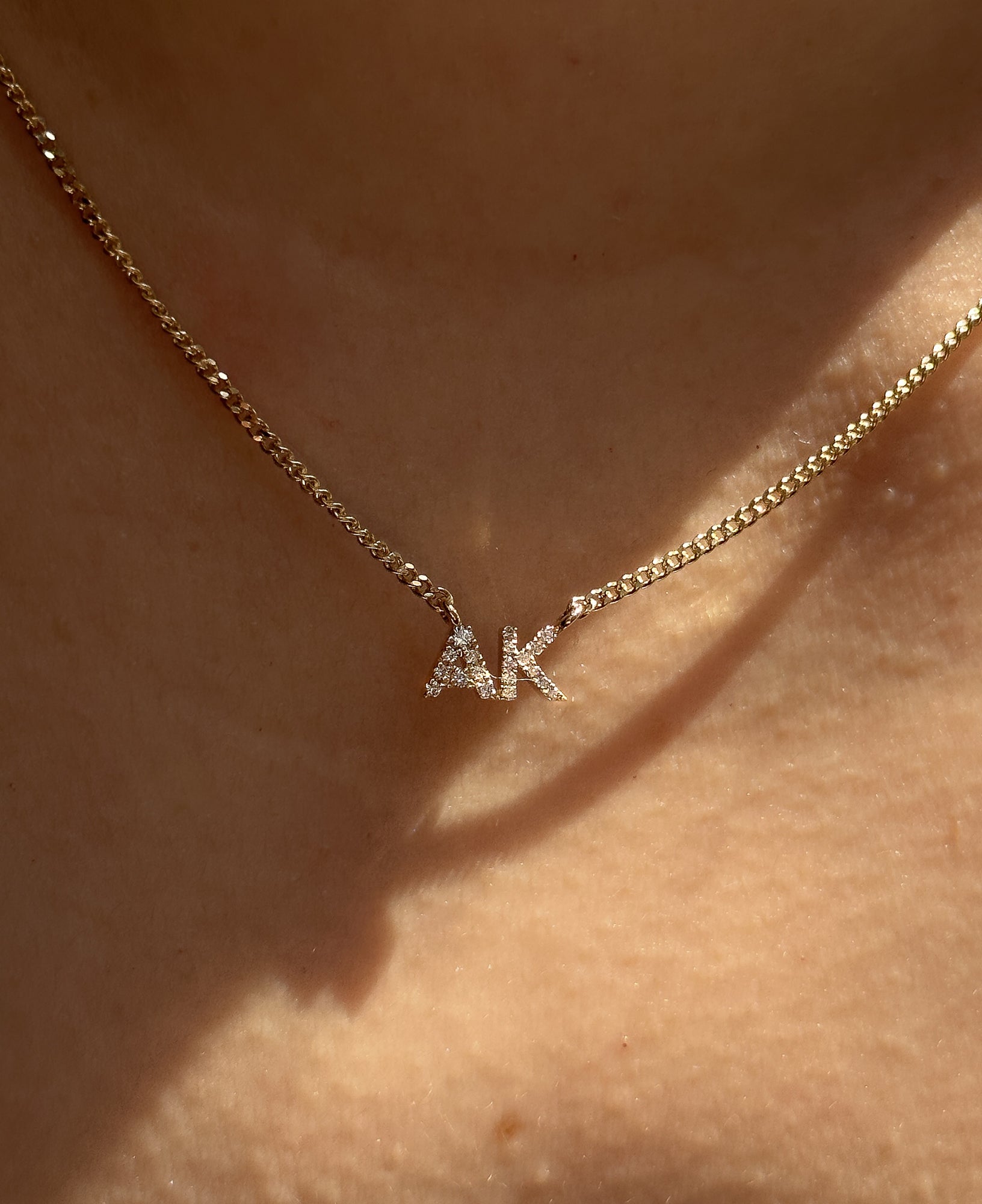 model shot of lottie custom diamond nameplate chain necklace