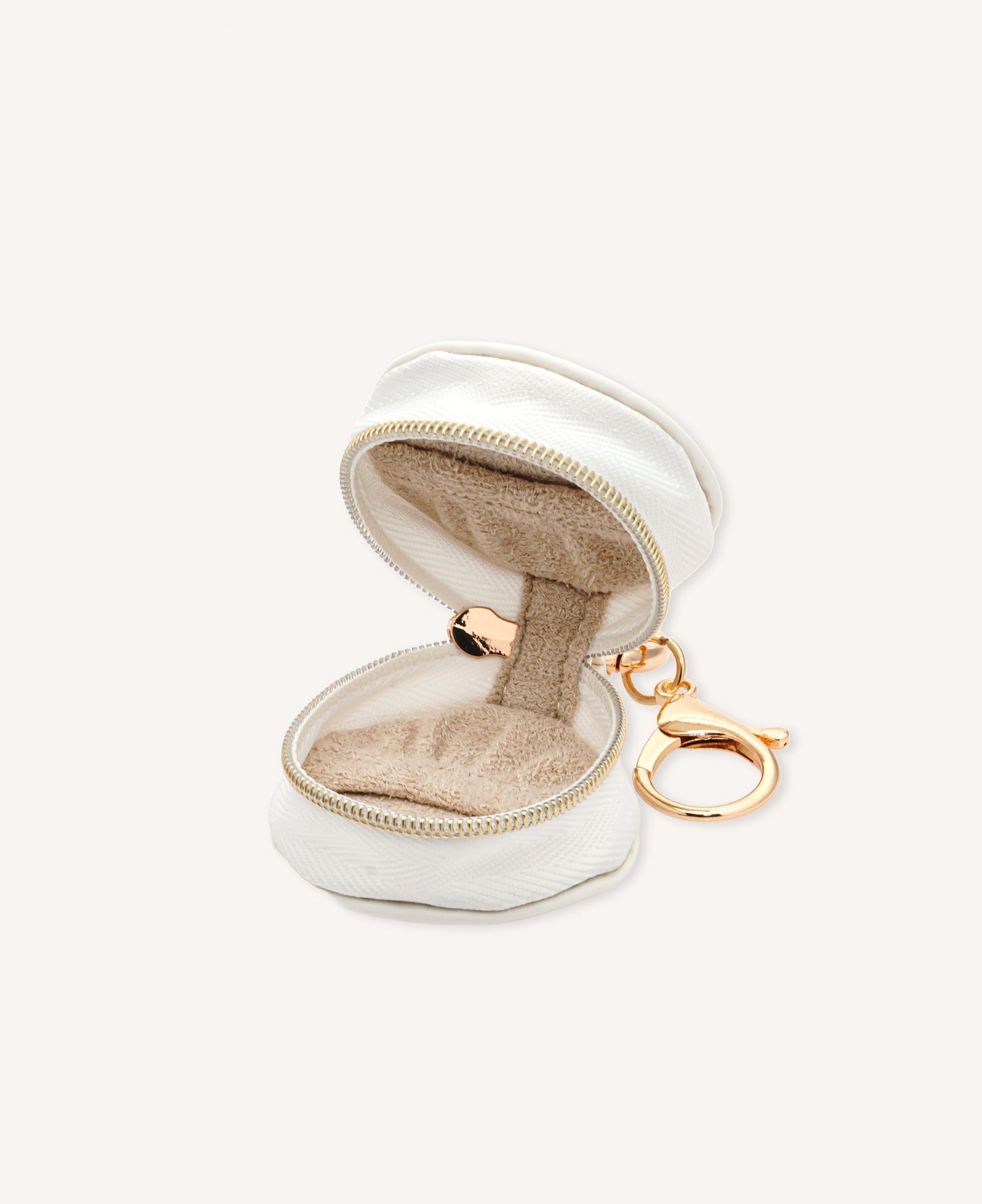 Close-up of a stylish Sachelle Collective bag charm, showcasing intricate details and quality craftsmanship, designed to personalize handbags and hold jewelry when you're on the go.