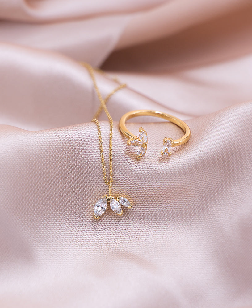 Lifestyle shot of the Colette 14k gold necklace and camille 14k gold open ring - Sachelle Collective
