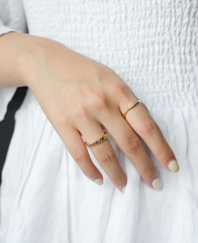 Model wearing 14k gold rings from Sachelle Collective