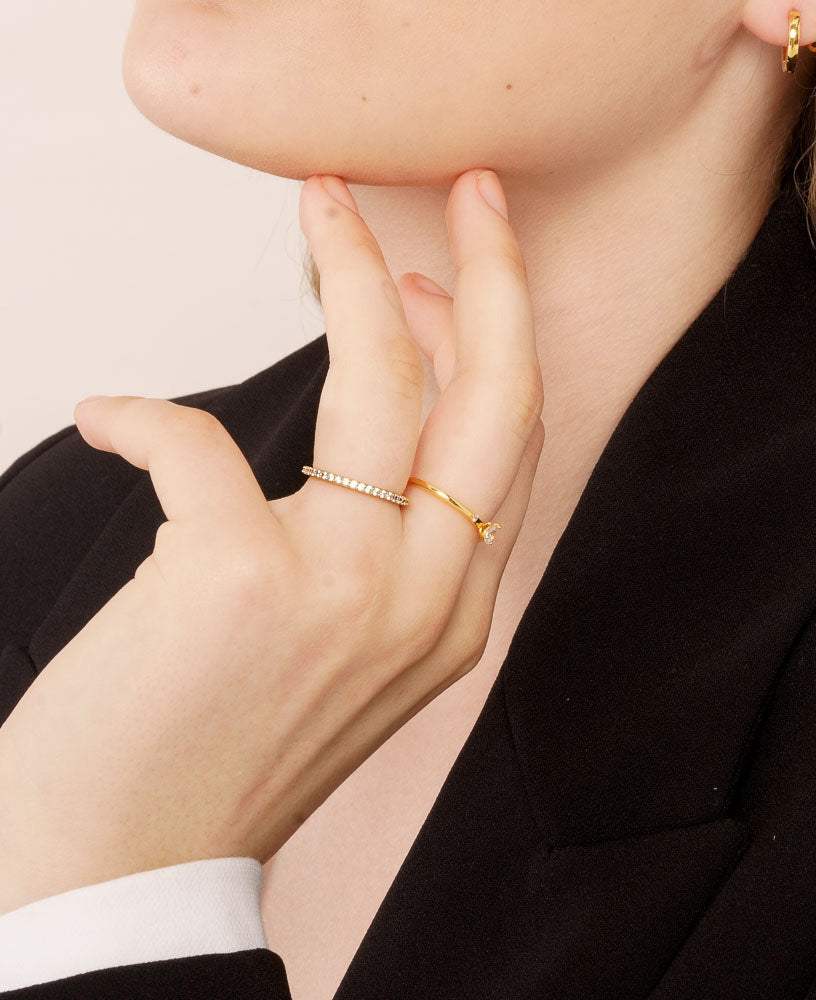 Jennifer Cubic zirconia classic dainty 14k gold eternity band ring lifestyle close up shot on model - sachelle collective