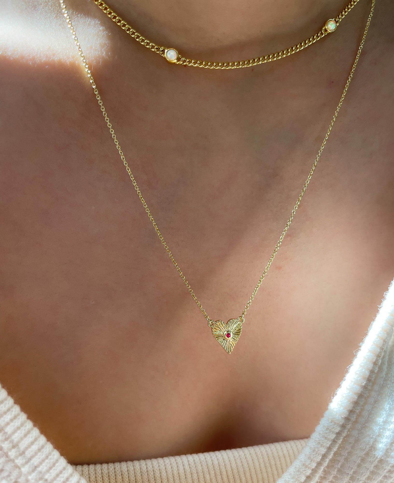 model wearing angelica heart necklace 14k gold