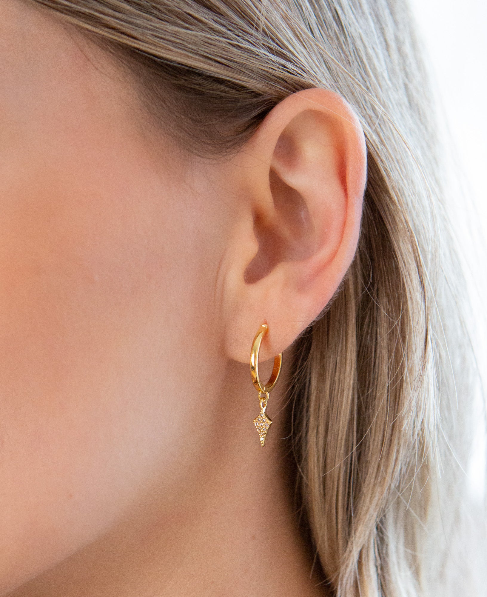 Close up detail shot on Elayne Pave CZ Gold Hoop Earrings 