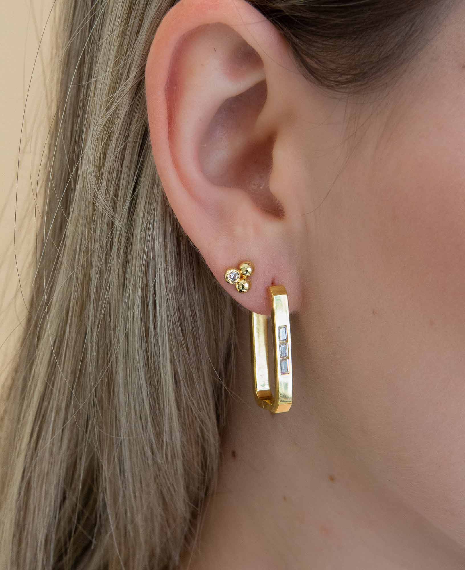Model wearing mabel 14k gold stud earring close up