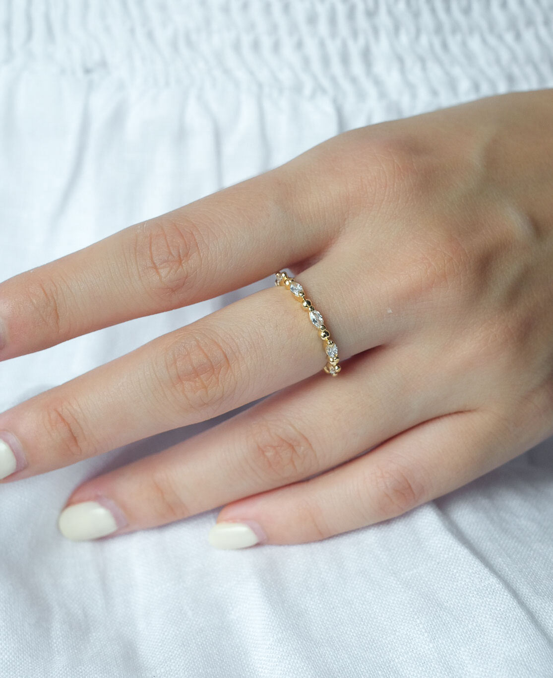 Close up lifestyle modelling shot of Meline 14k Gold Bead Ring
